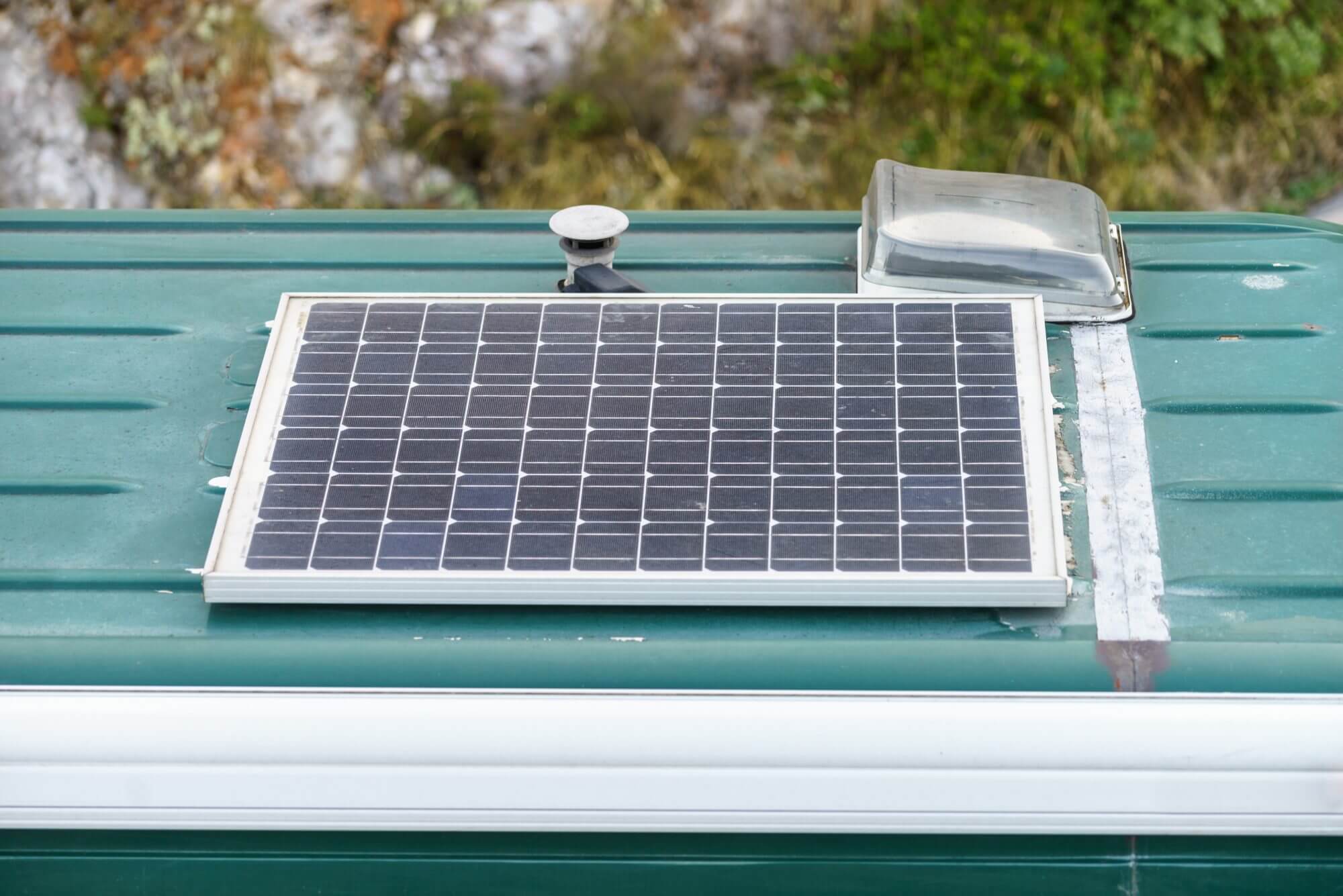 Solar panels on roof top of the van car. Energy saving and production in vehicle