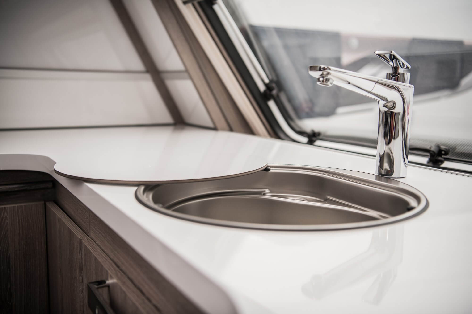 Circular RV Camper Sink and Faucet. Elegant Recreation Vehicle Interior.