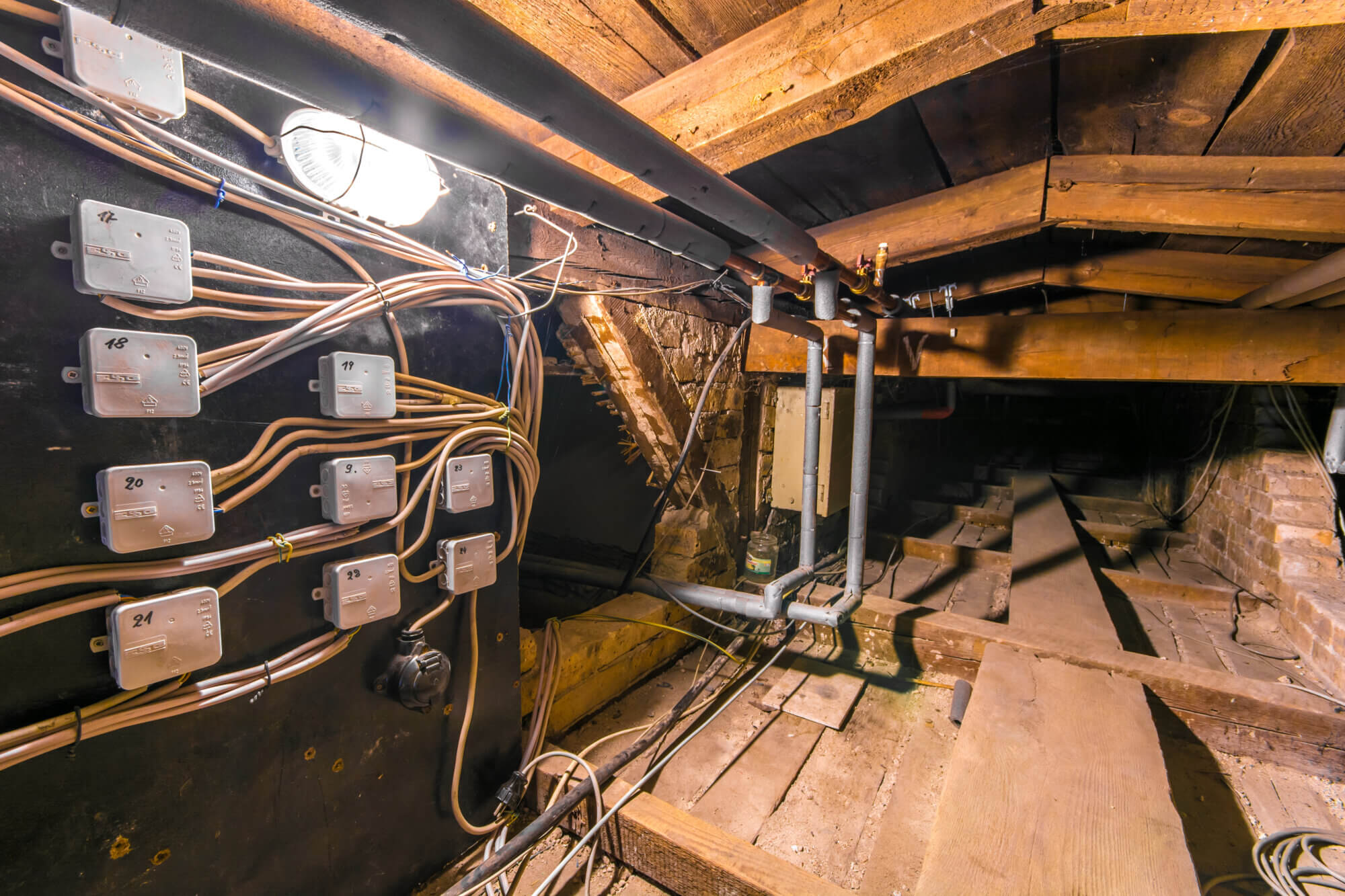 Power lines in the attic of an old half-timbered house