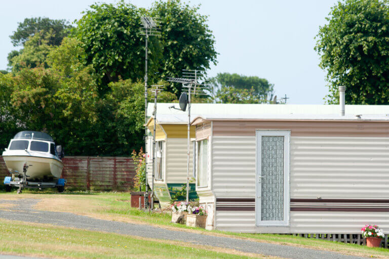 Holiday homes-Chalets in rural wales, withboat parked up ready for the ocean.