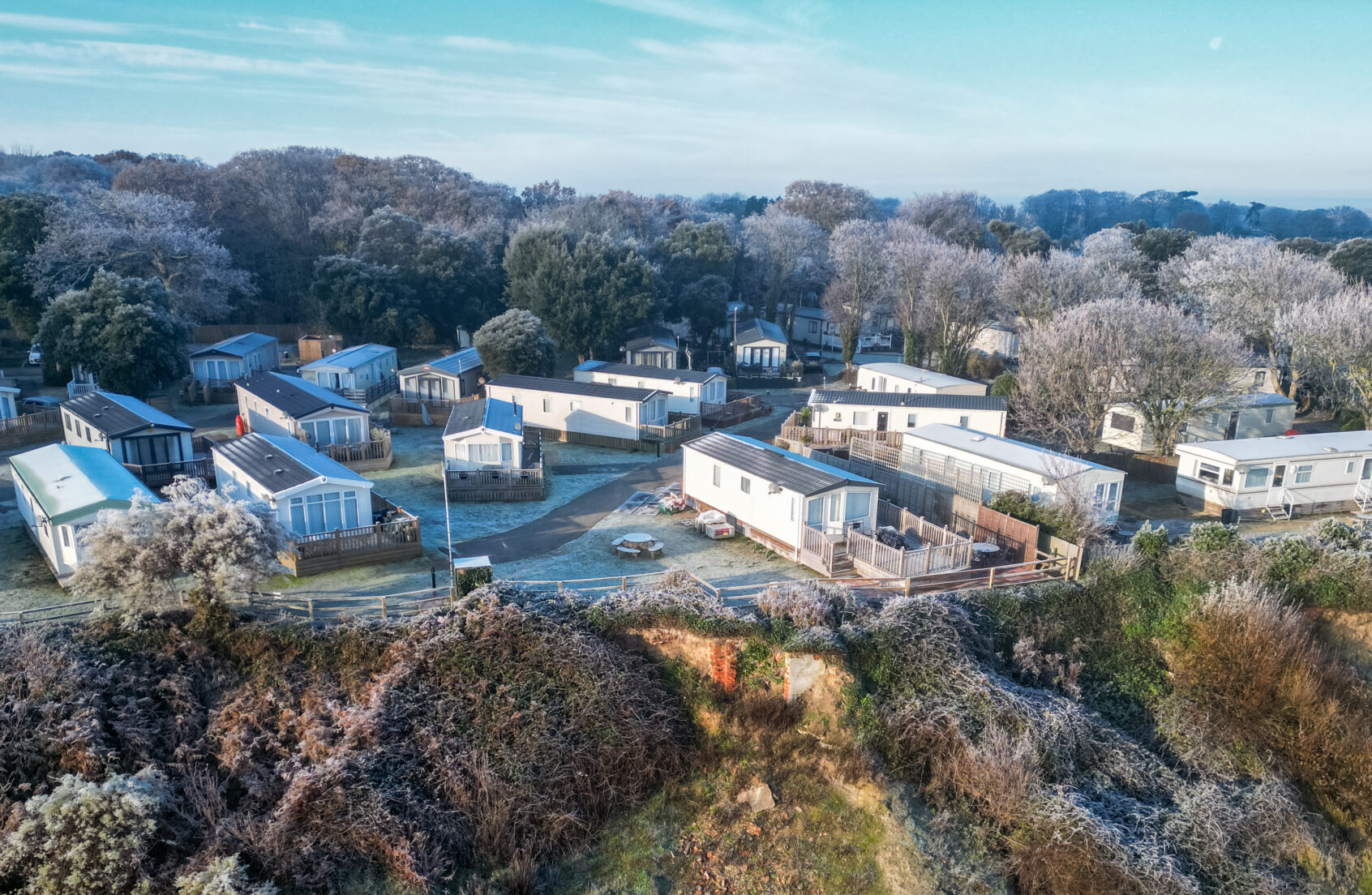 Drone view of seaside static caravans seen during mid winter. The homes are located on the Suffolk coast and are not occupied this time of year.