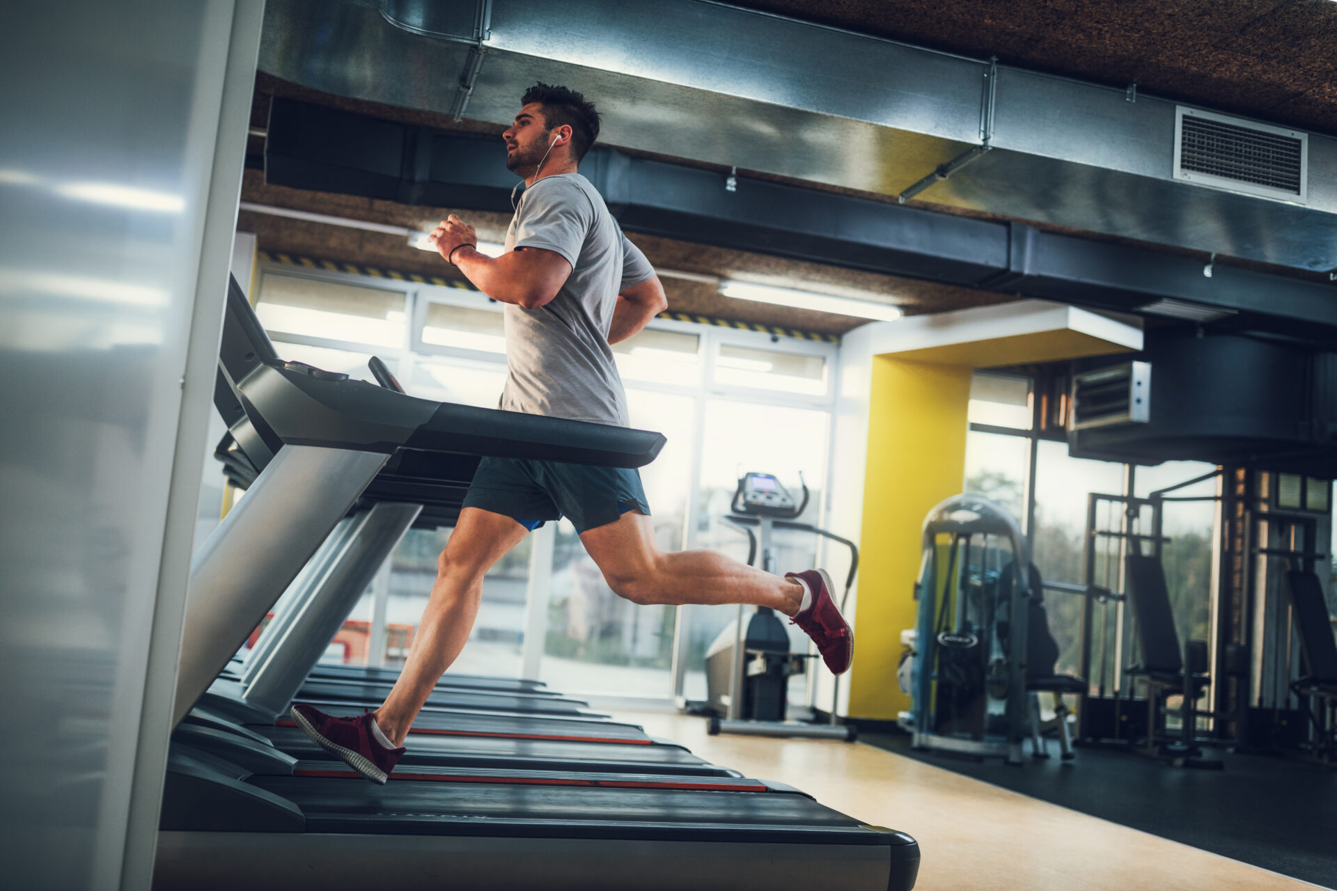 Male running on treadmill at the gym