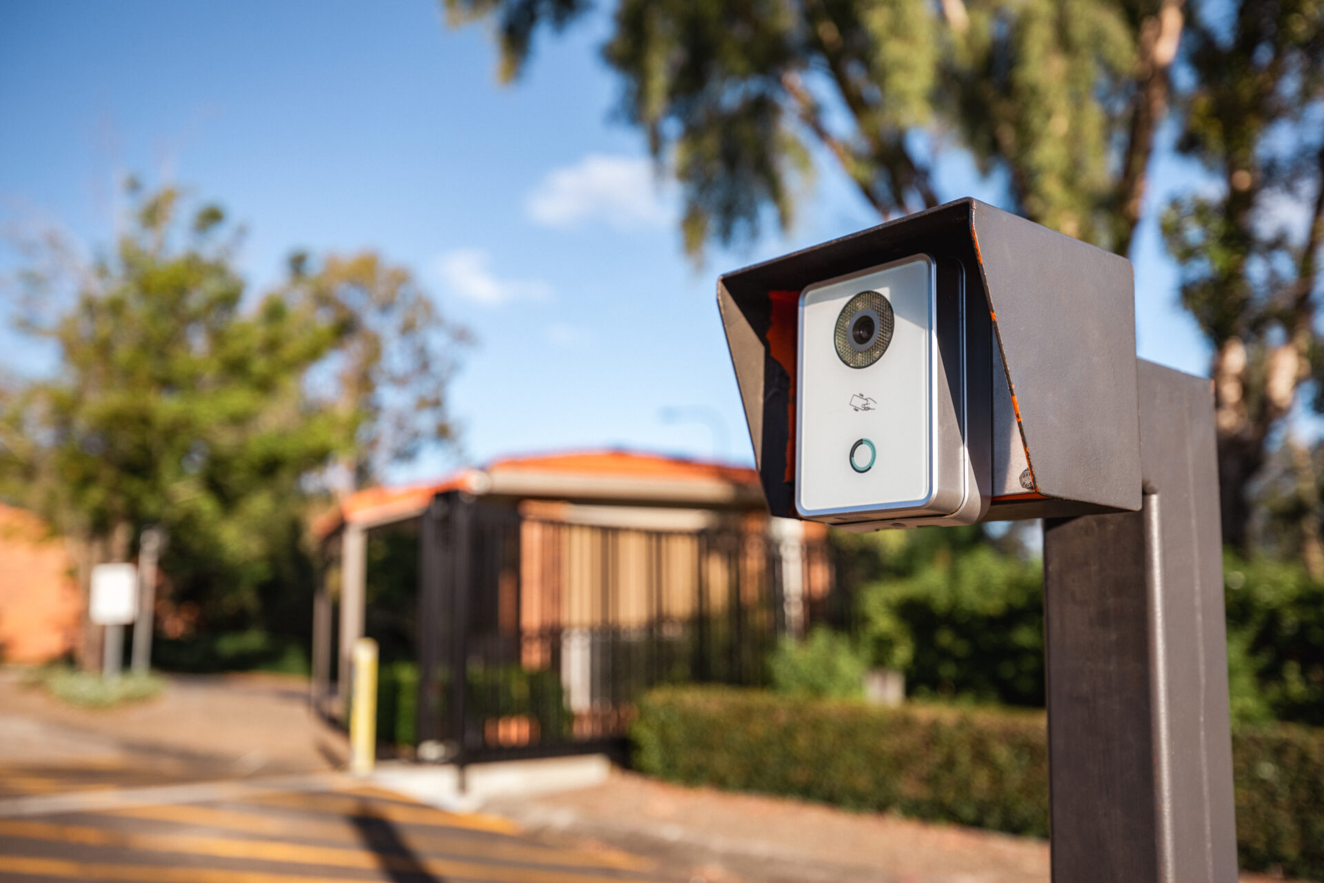 A security camera at the front entrance to a gated community, helping to keep the residents and neighbourhood safe.