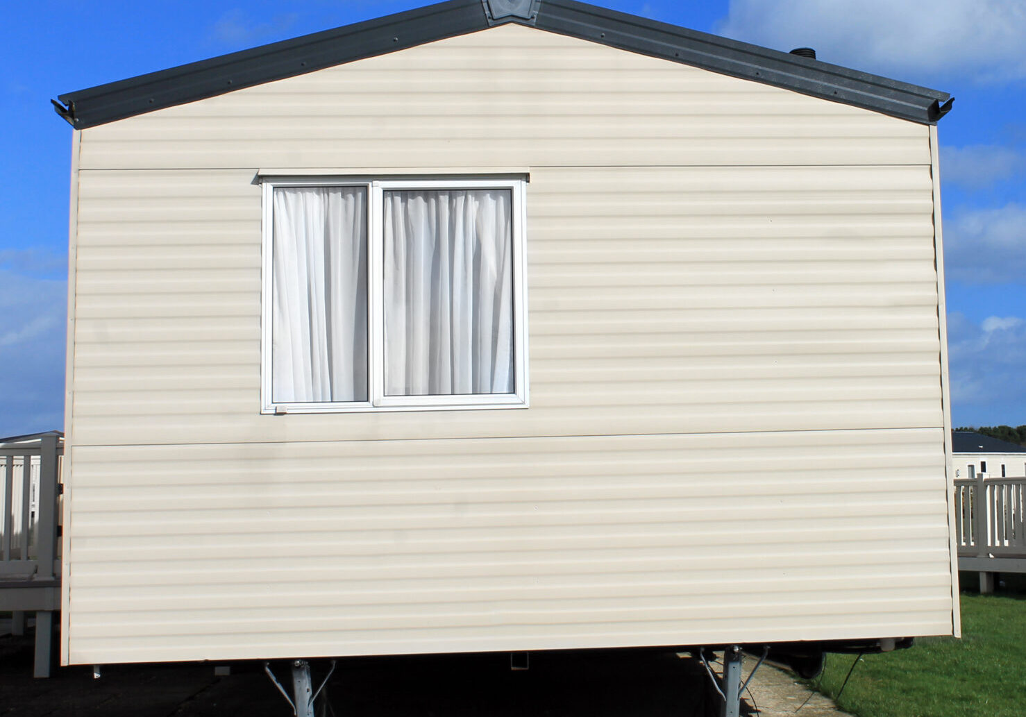 Exterior of a caravan in a trailer park.